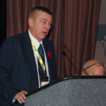 Executive Assistant Harry Sutton addresses the conference