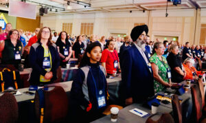 UFCW Locals 175 & 633 delegates standing in the convention hall.