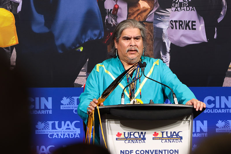 UFCW Resident Elder Eric Flett speaks from the podium