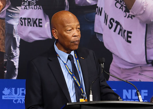 UFCW International President Milton Jones speaks to delegates from the podium on stage