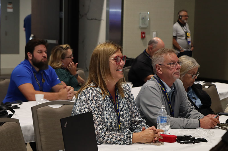 President Tosato, Secretary-Treasurer McLean and other staff seated in the audience at the 2025 NDF Convention.