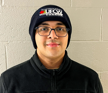 Mohit standing and posing in front of the camera.