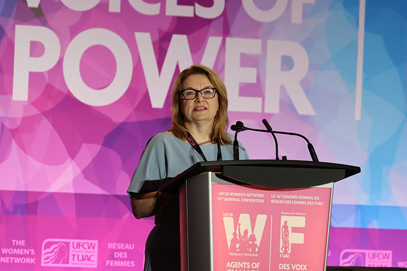 CLC President Bea Bruske speaks at the microphone