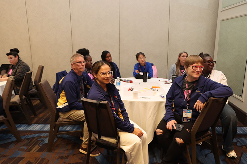Secretary-Treasurer Jim McLean and delegates seated during a workshop