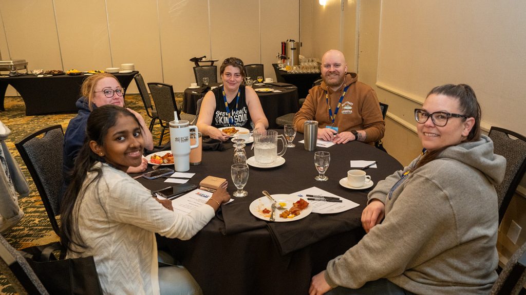 Member group shot during breakfast. 