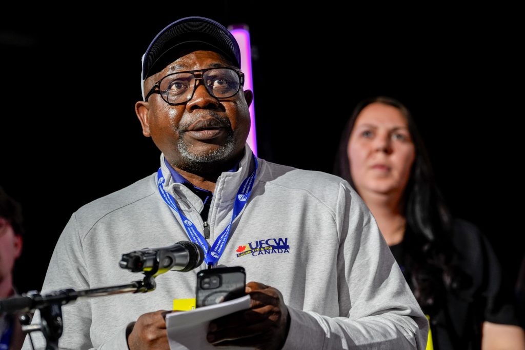 A UFCW delegate speaks at the microphone