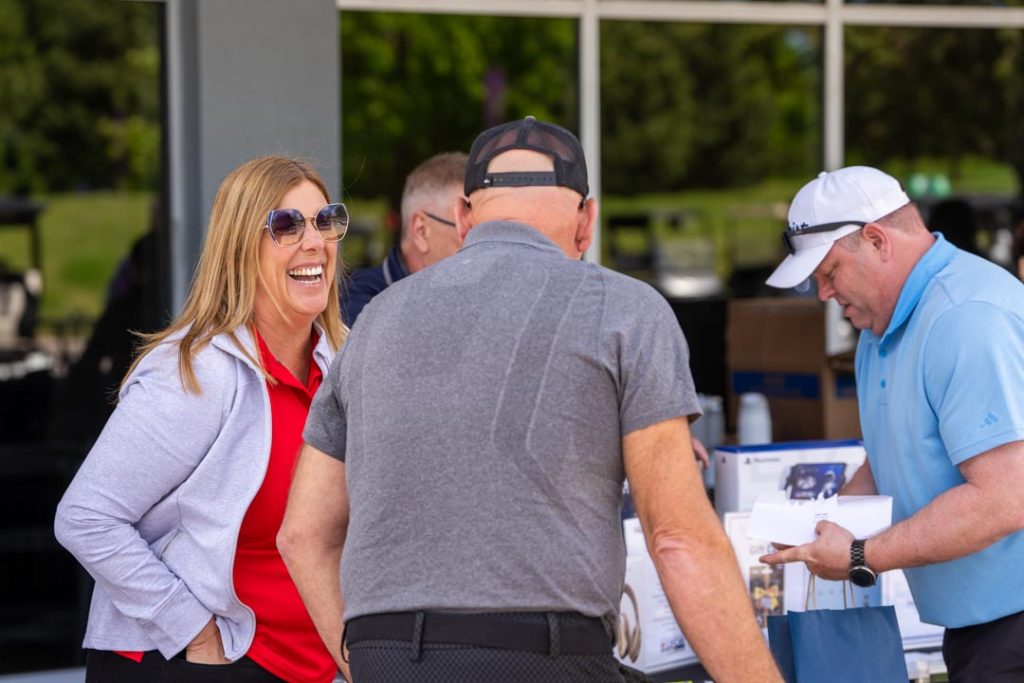 UFCW 175 President Kelly Tosato laughs with members at the UFCW Locals 175 & 633 Golf Tourmament