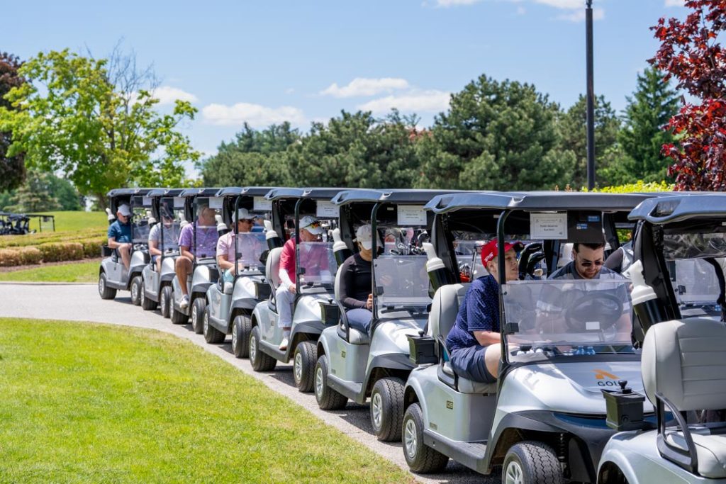 The UFCW Locals 175 & 633 commmunity standing by in their golf carts.