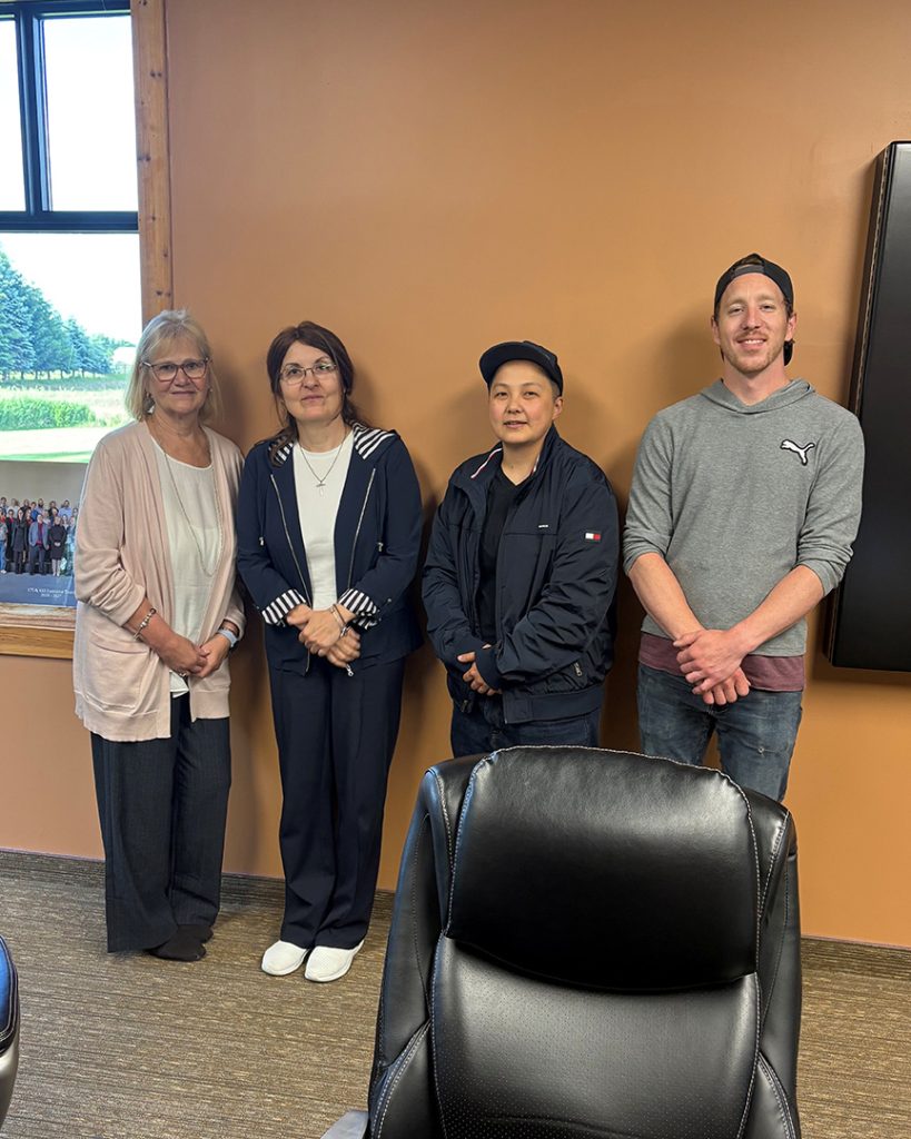 Pano Cap negotiation committee smiles for a group photo.