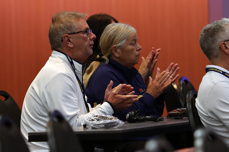 Secretary-Treasurer Jim McLean and Executive Assistant Angela Mattioli applaud