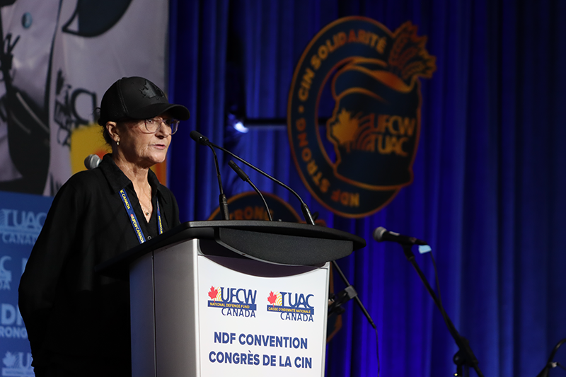 A UFCW steward speaks from the podium during a sector presentation
