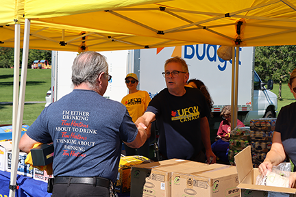 Secretary-Treasurer Jim Mclean shakes a members' hand in Cornwall