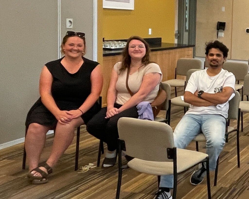 3 people seated during ratification for a Karis Kawartha Lakes First Collective agreement