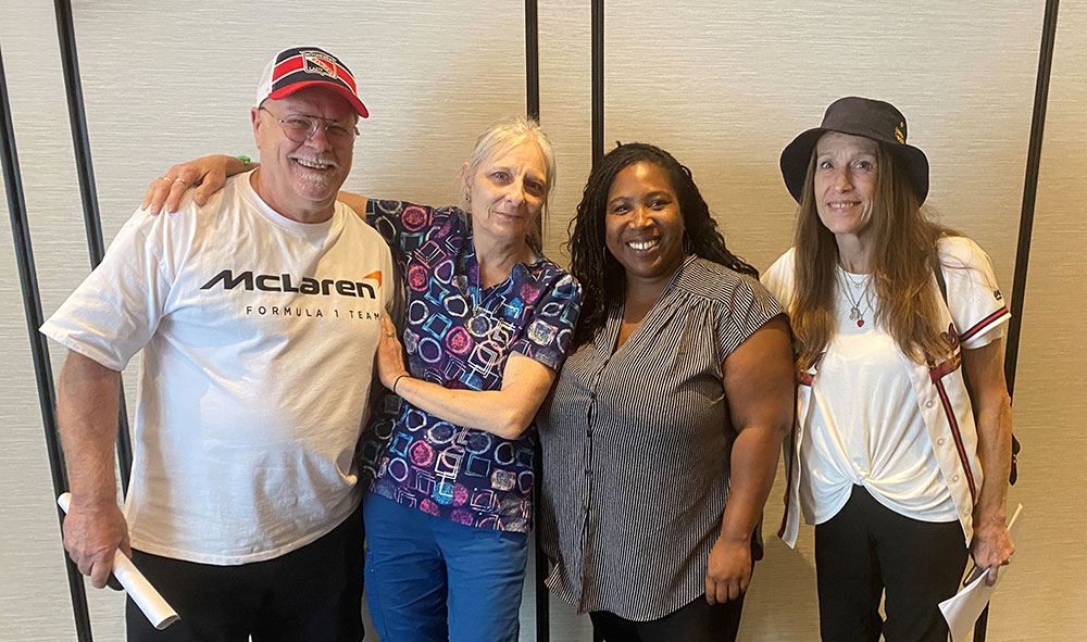 four committee members from the Waterloo Heights first collective agreement